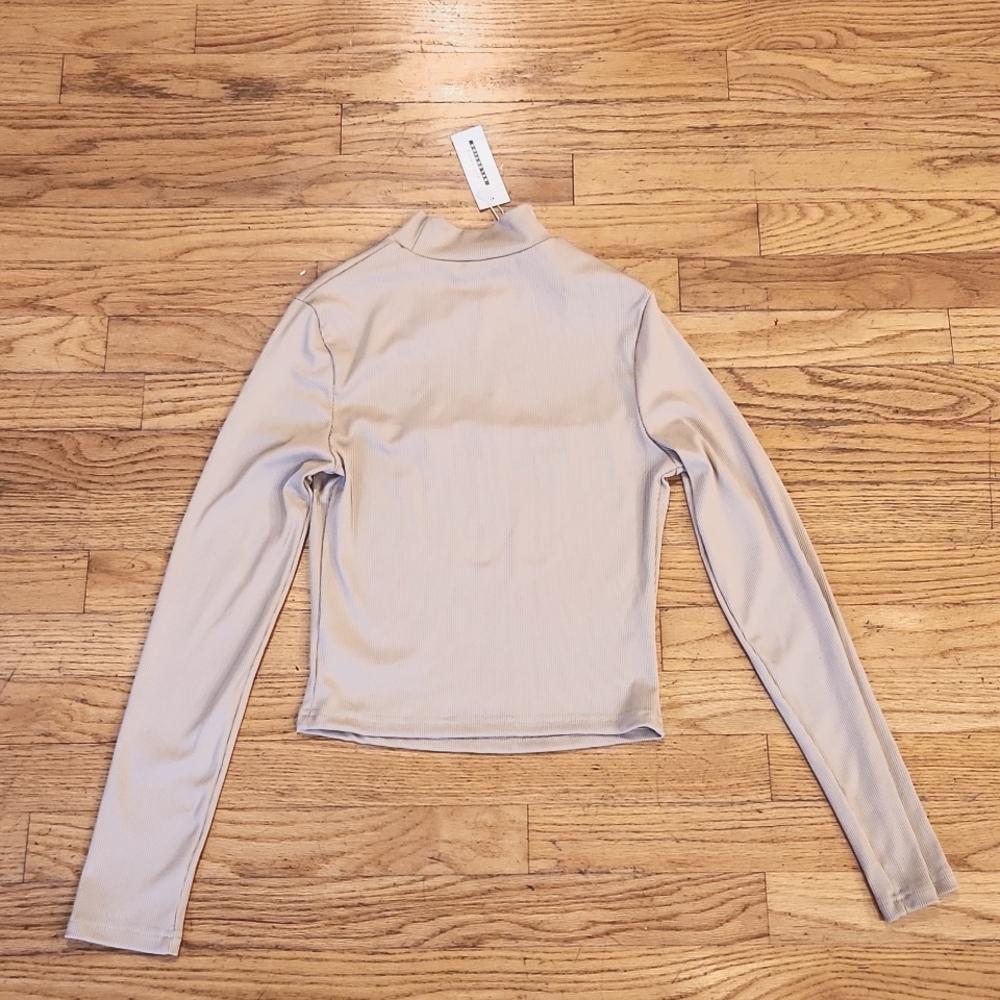 CBR  NWT size small turtleneck with keyhole back